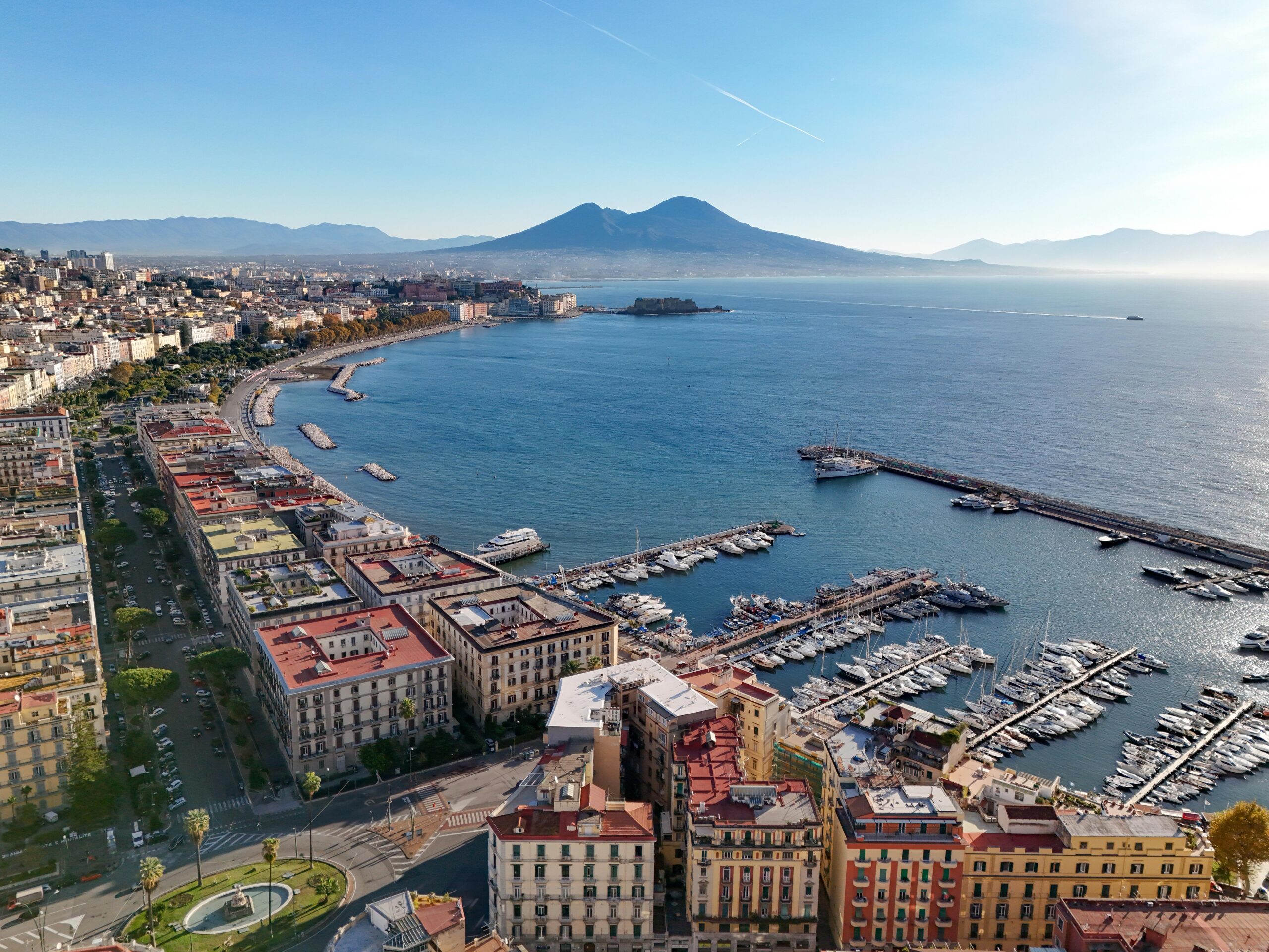 Stunning aerial view of Naples, Italy with Mount Vesuvius and marina.